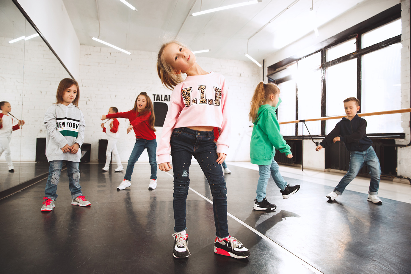 kids-at-dance-school-ballet-hiphop-street-funky-and-modern-dancers-over-studio-background-(1)